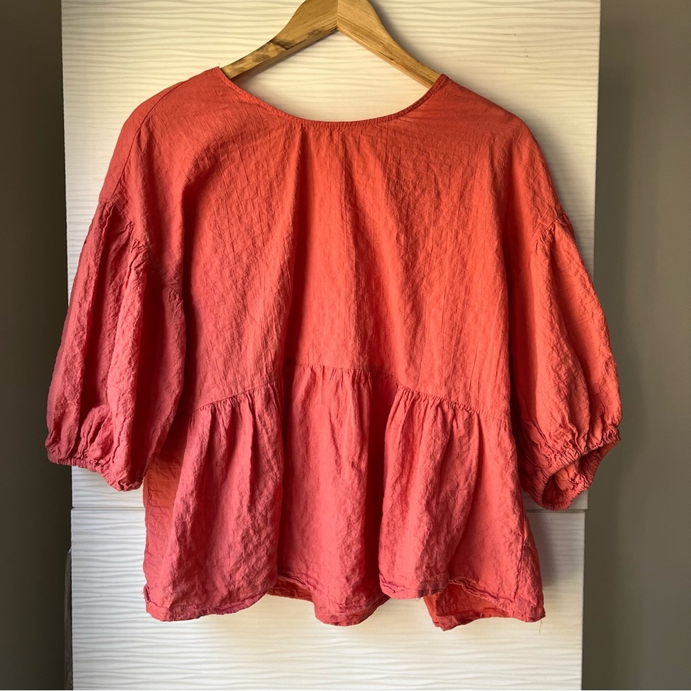 Textured coral puff sleeve peplum top